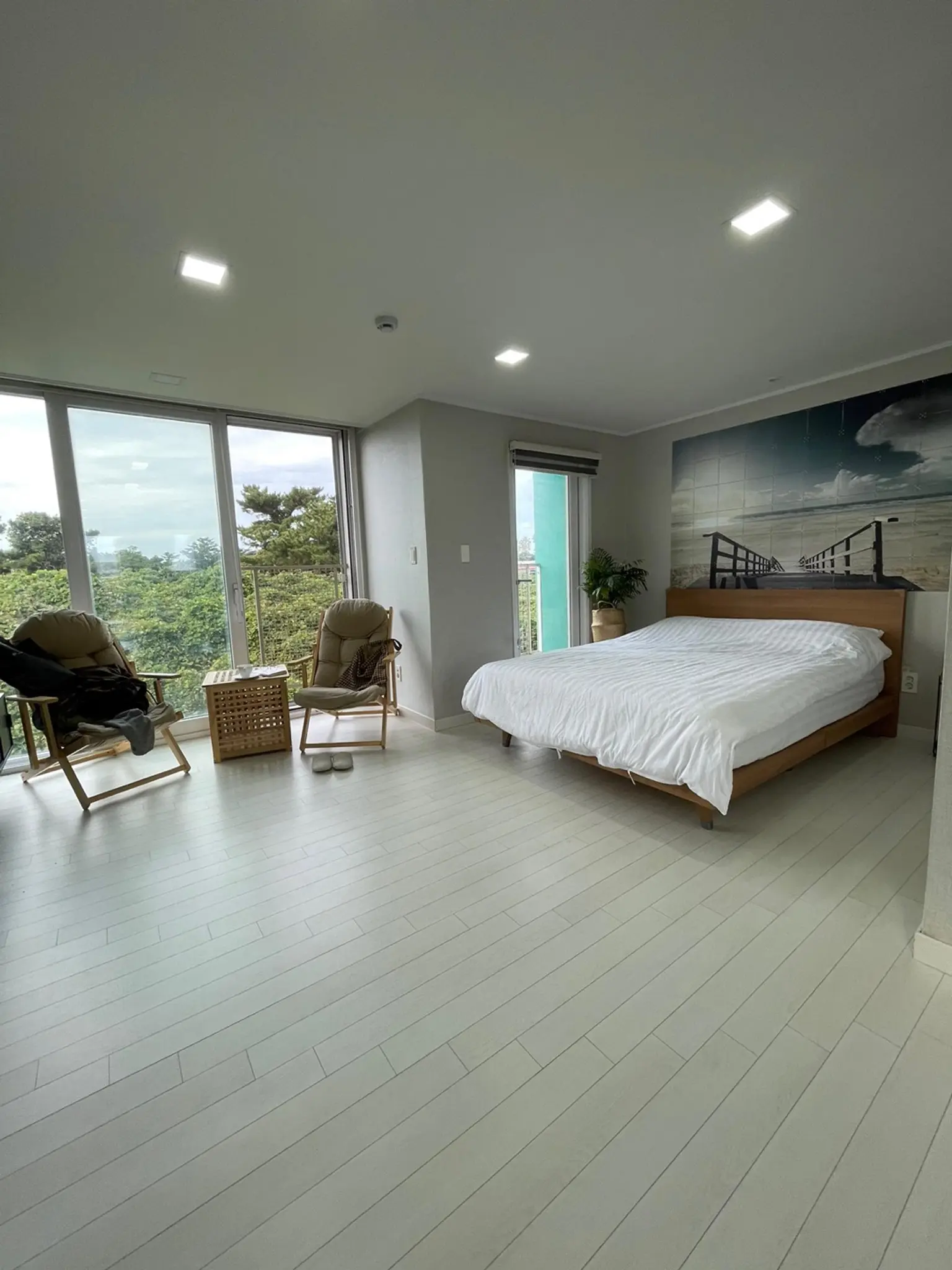 A green, fully-furnished studio-type one-room apartment located 7 minutes walk from Jeju Hallim Geumneung Beach - main image