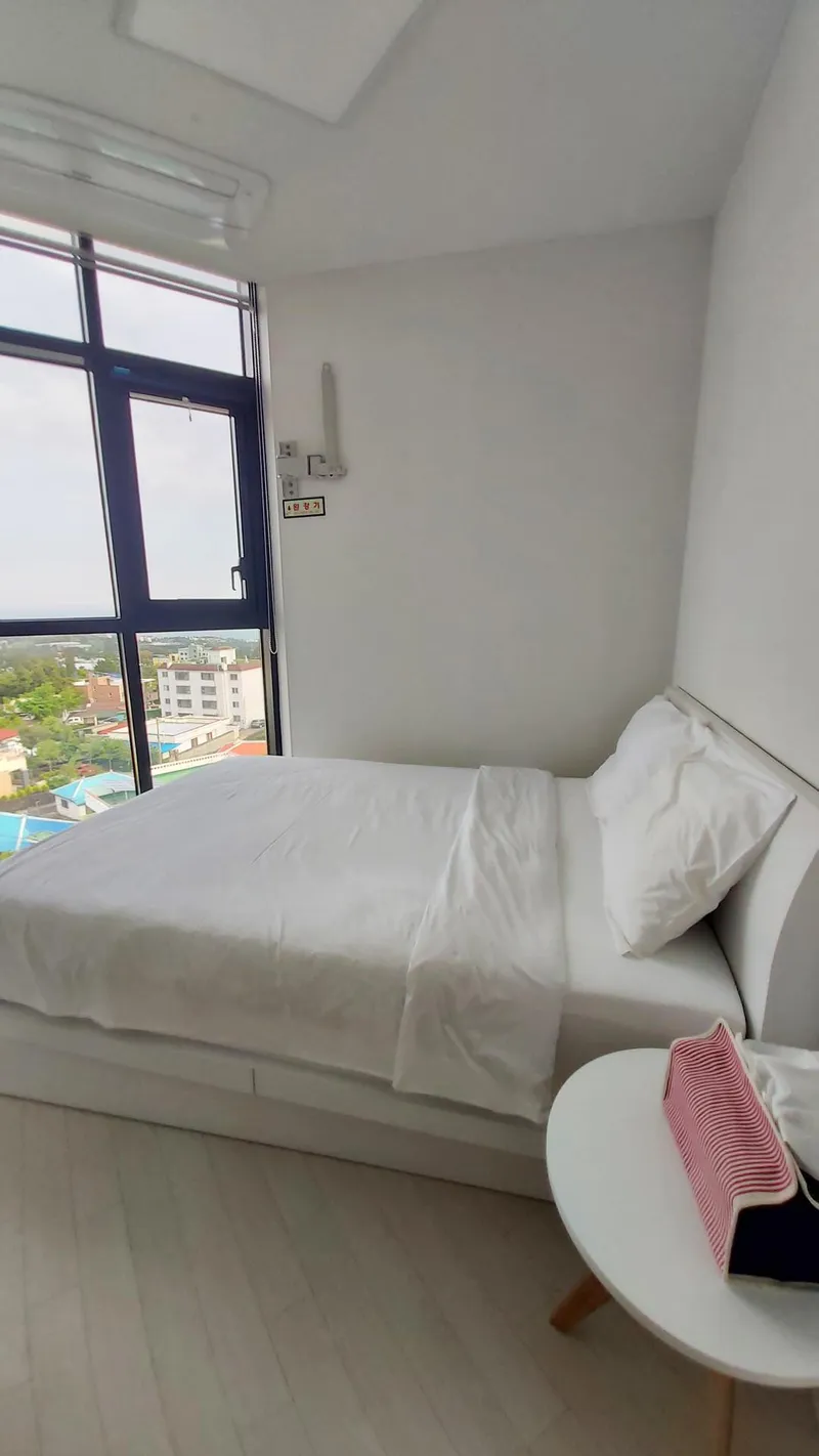 [Seoho-dong, Seogwipo] Room 703: Ocean View from My Own Master Room Beyond the Floor-to-Floor Window_Newly Built Two-Room Wells Place 4