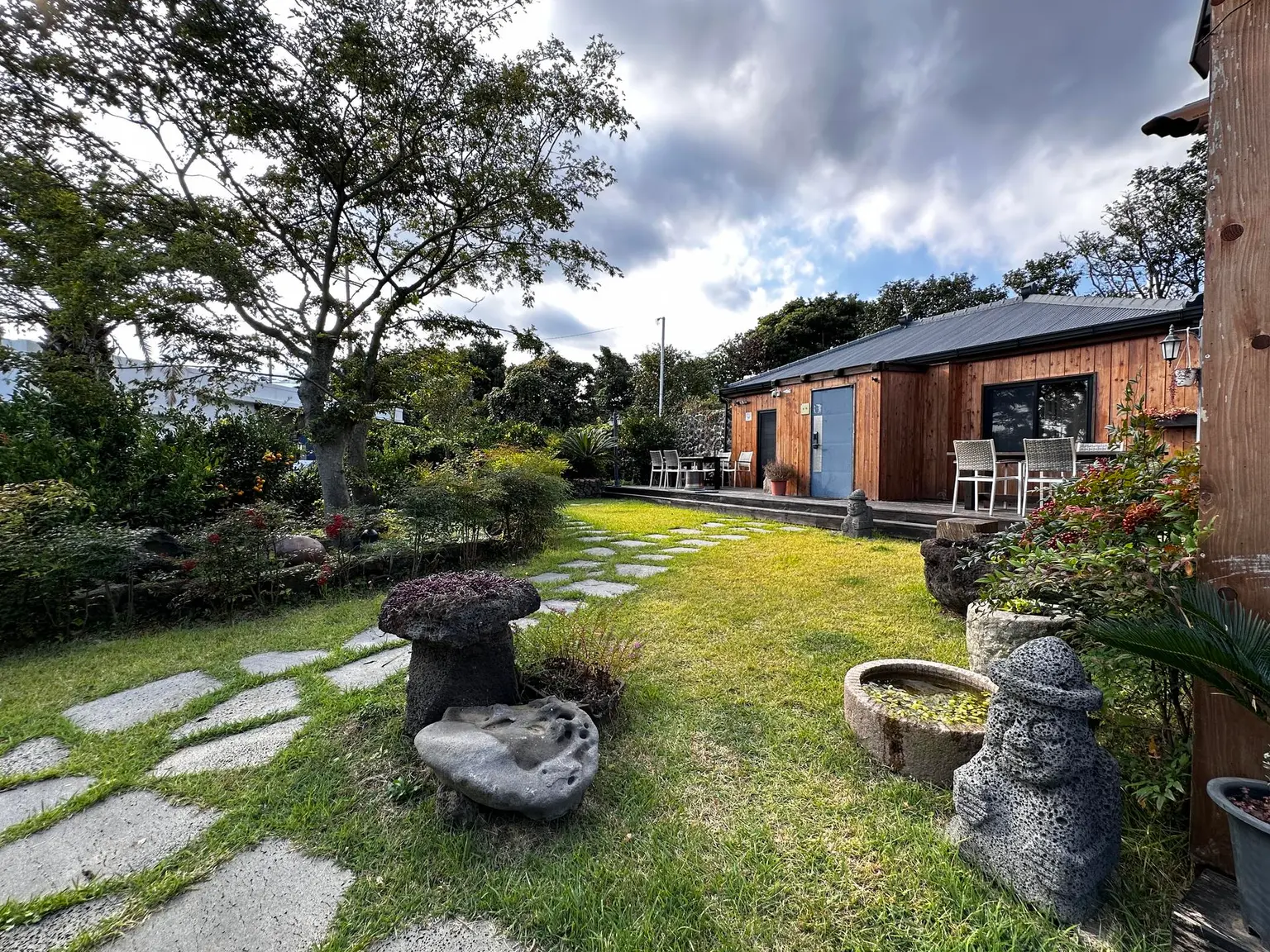 Jeju Seongsan Private spa pension surrounded by tangerine trees and stone walls - main image